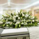 Funeral Arrangement Covers Box With White Roses and Lilies