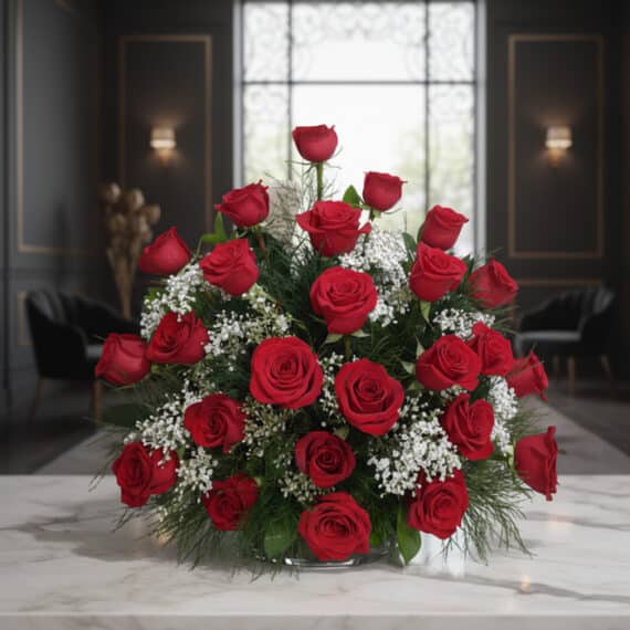 Arreglo Floral Me Tienes Loco: Rosas Rojas Premium para Enamorar Arreglo floral 'Me Tienes Loco' con rosas rojas frescas y follaje verde, sobre una mesa de mármol en un elegante lobby de hot